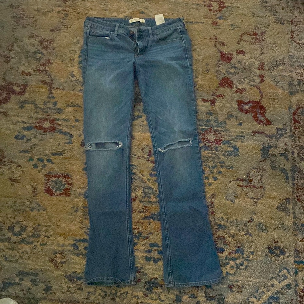 Boot cut light wash low rise distressed jeans